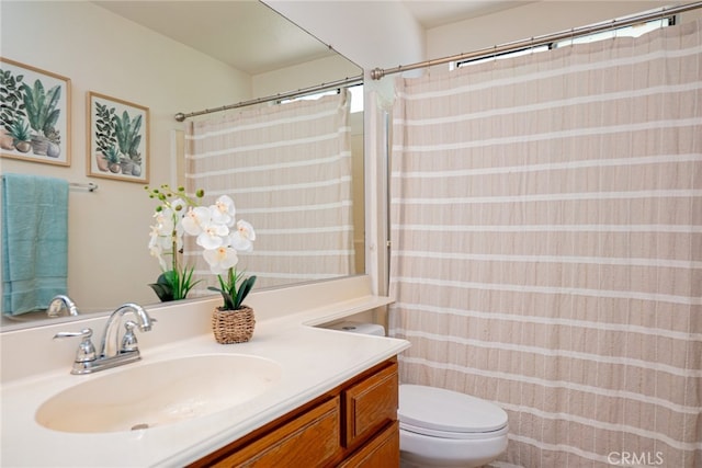 8541 San Clemente Dr, Rancho Cucamonga, CA 91730 - bathroom featuring toilet, vanity, and curtained shower