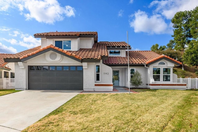 1142 Cabot Ct, Vista, CA 92081 - mediterranean / spanish-style house featuring stucco siding, driveway, a garage, and a tile roof