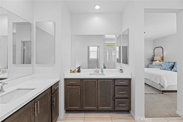4233 Powell Way Unit 102, Corona, CA 92883 - bathroom with two vanities, ensuite bath, and tile patterned floors