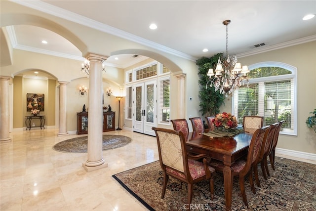23965 Lawson Rd, Corona, CA 92883 - dining space featuring decorative columns, arched walkways, french doors, crown molding, and a chandelier