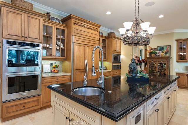 23965 Lawson Rd, Corona, CA 92883 - kitchen with appliances with stainless steel finishes, a sink, brown cabinetry, crown molding, and a center island with sink