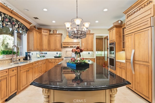 23965 Lawson Rd, Corona, CA 92883 - kitchen with paneled fridge, a sink, stainless steel double oven, a chandelier, and a breakfast bar