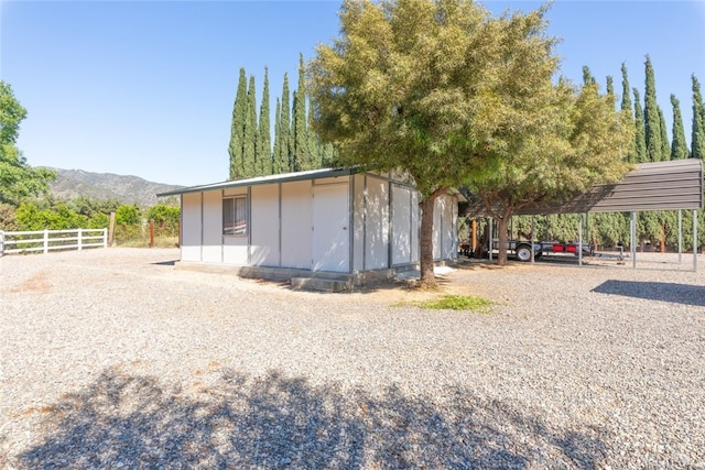 23965 Lawson Rd, Corona, CA 92883 - view of outbuilding featuring fence, a mountain view, and an outdoor structure