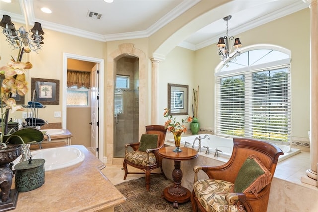23965 Lawson Rd, Corona, CA 92883 - living area featuring arched walkways, a chandelier, tile patterned flooring, decorative columns, and crown molding