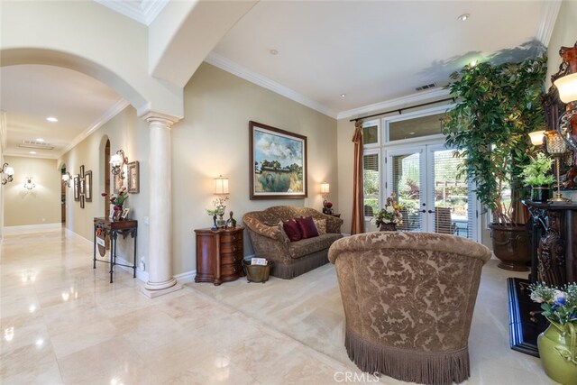 23965 Lawson Rd, Corona, CA 92883 - living room with arched walkways, decorative columns, crown molding, baseboards, and french doors