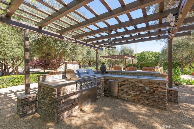 23965 Lawson Rd, Corona, CA 92883 - view of patio with a pergola, a grill, and an outdoor kitchen
