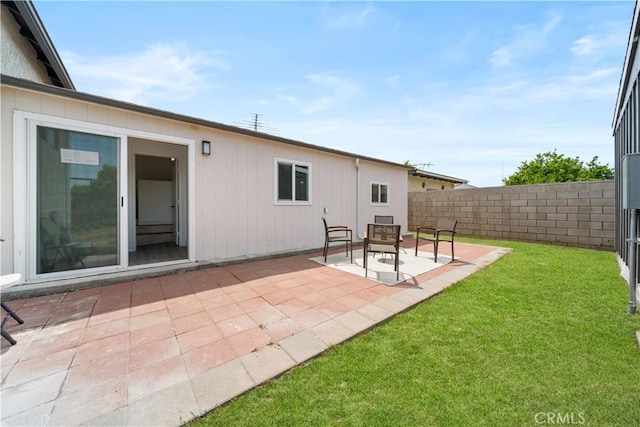 rear view of house with a patio