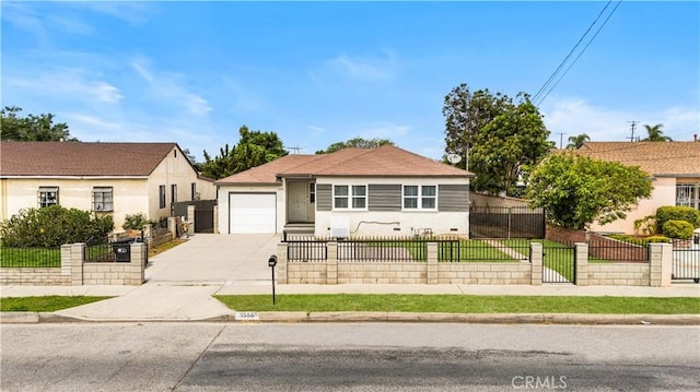 view of front of property with driveway and a garage