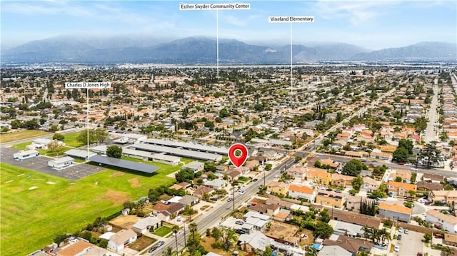 aerial view of residential area featuring mountains