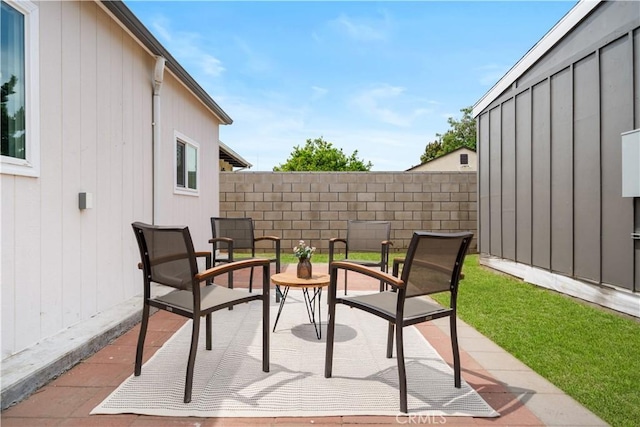view of patio / terrace featuring fence