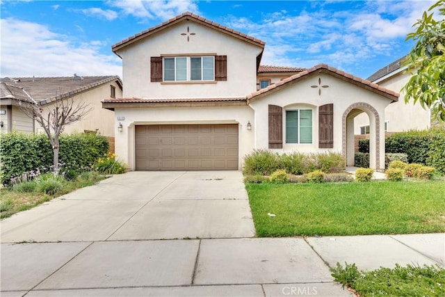 5610 Guardian Way, Chino, CA 91710 - mediterranean / spanish house featuring a garage, stucco siding, a front yard, and concrete driveway