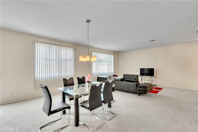 5610 Guardian Way, Chino, CA 91710 - dining room with light carpet and a chandelier