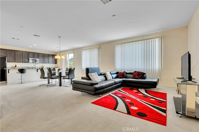 5610 Guardian Way, Chino, CA 91710 - living room with light colored carpet, a chandelier, and recessed lighting