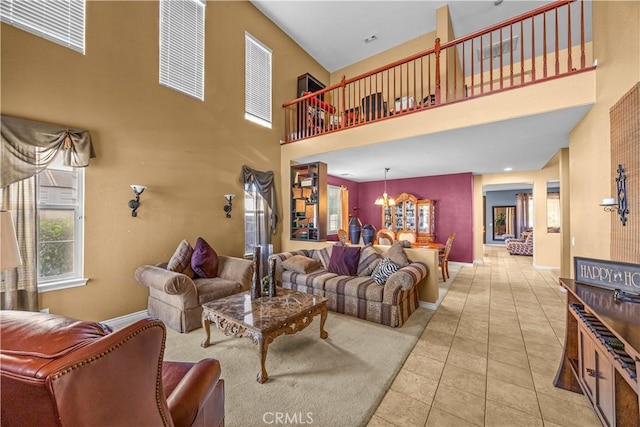 33727 Verbena, Murrieta, CA 92563 - living area featuring a towering ceiling, tile patterned floors, a chandelier, and baseboards