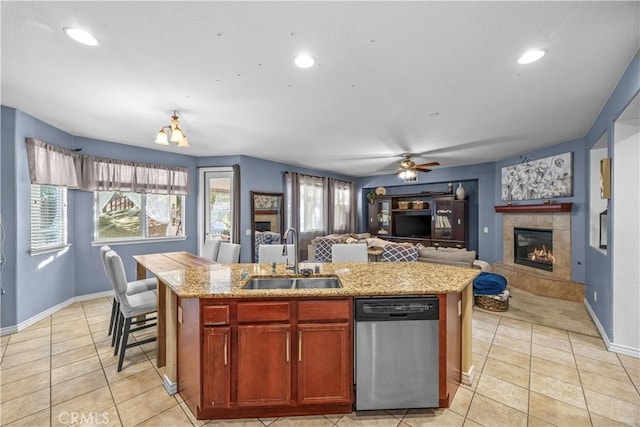 33727 Verbena, Murrieta, CA 92563 - kitchen with stainless steel dishwasher, a sink, ceiling fan, light tile patterned flooring, and plenty of natural light