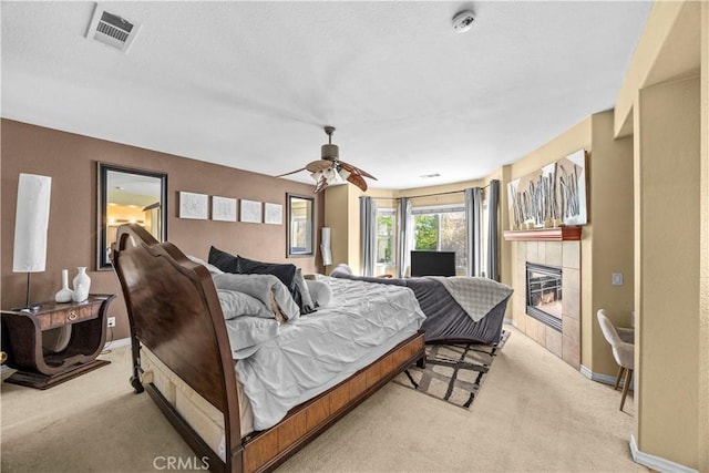 33727 Verbena, Murrieta, CA 92563 - bedroom with light carpet, a tiled fireplace, baseboards, and ceiling fan