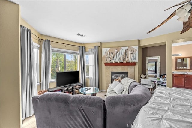 33727 Verbena, Murrieta, CA 92563 - bedroom with a tiled fireplace and ceiling fan