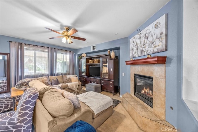 33727 Verbena, Murrieta, CA 92563 - living room featuring ceiling fan, a tile fireplace, and light colored carpet