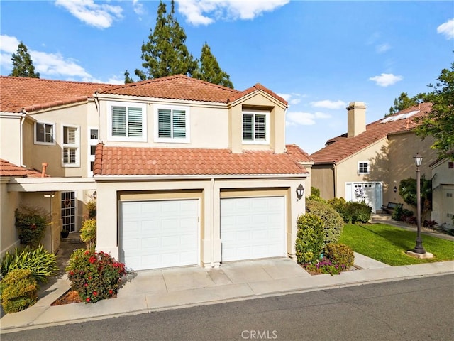 37 Giotto, Aliso Viejo, CA 92656 - view of front of property with a tiled roof, driveway, stucco siding, and an attached garage