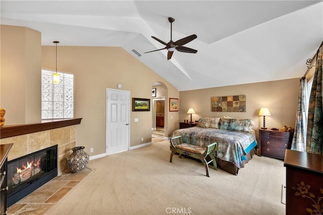 37 Giotto, Aliso Viejo, CA 92656 - bedroom featuring lofted ceiling, carpet, arched walkways, a tile fireplace, and baseboards
