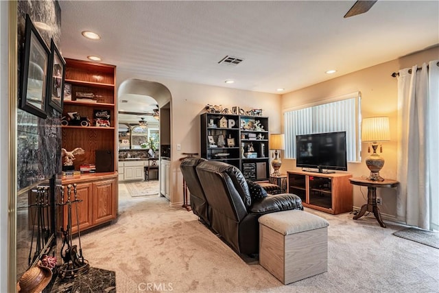 30208 White Wake Dr, Canyon Lake, CA 92587 - living room featuring ceiling fan, light colored carpet, arched walkways, and recessed lighting