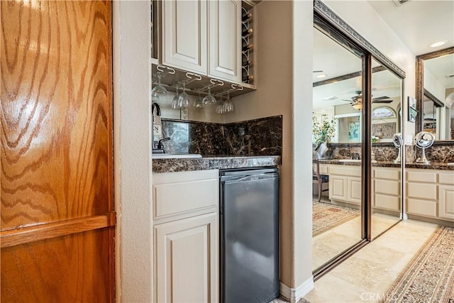30208 White Wake Dr, Canyon Lake, CA 92587 - kitchen with dark countertops, a ceiling fan, a sink, and dishwashing machine