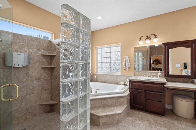 13985 Evergreen Ln, Victorville, CA 92395 - full bath featuring a tile shower, plenty of natural light, a bath, and vanity