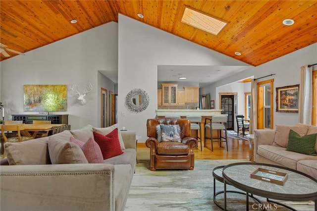 523 Dogwood Canyon Rd, Blue Jay, CA 92317 - living area with light wood-type flooring, recessed lighting, wood ceiling, high vaulted ceiling, and a skylight