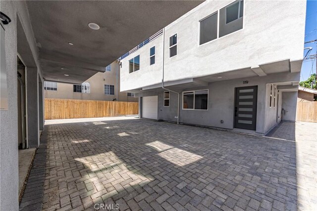 view of patio / terrace featuring fence