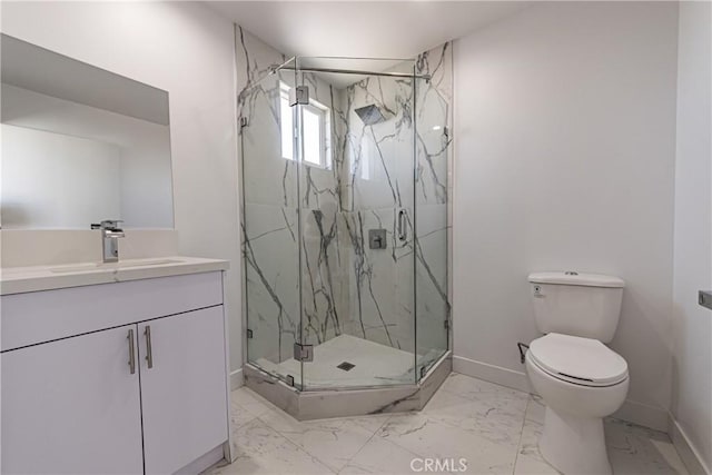 bathroom featuring marble look tile flooring, baseboards, toilet, a marble finish shower, and vanity