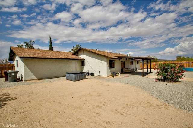 back of house with a patio, fence, and stucco siding