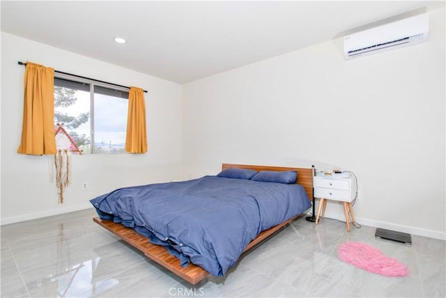 bedroom featuring a wall unit AC, baseboards, and recessed lighting