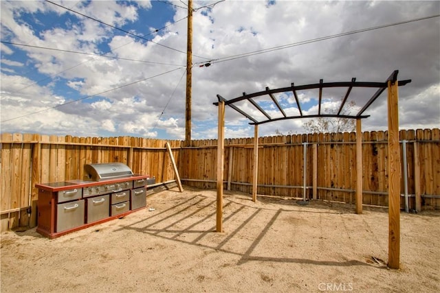 view of patio featuring a fenced backyard and grilling area