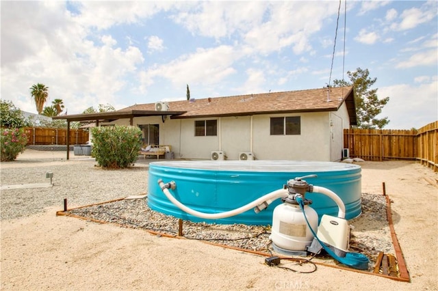 view of swimming pool with a fenced backyard and a patio