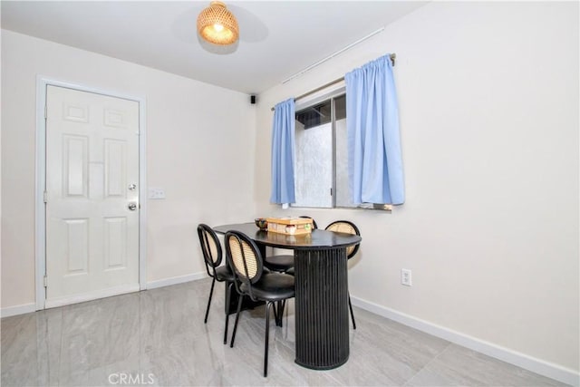 dining room with baseboards