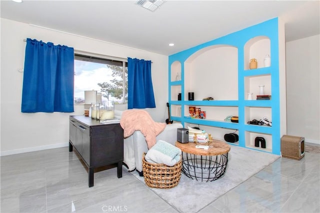 sitting room featuring baseboards