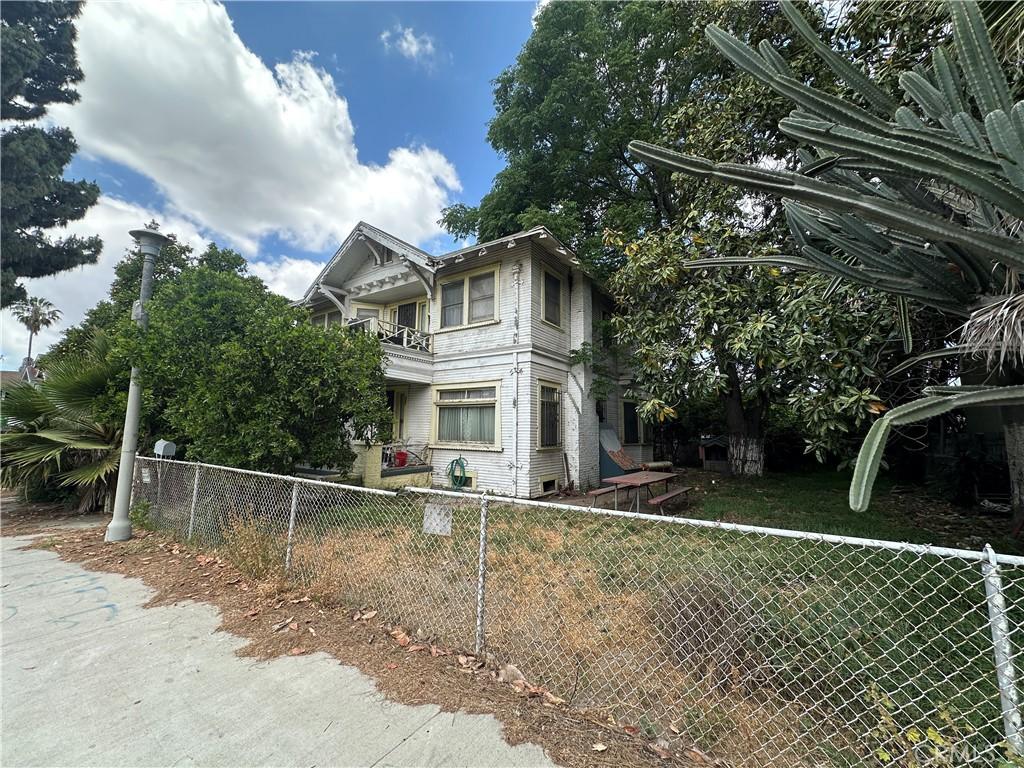 view of side of home with a balcony