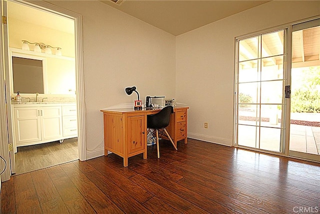 6102 Cabriolet Ct, Quartz Hill, CA 93536 - home office with dark wood finished floors, a sink, and baseboards