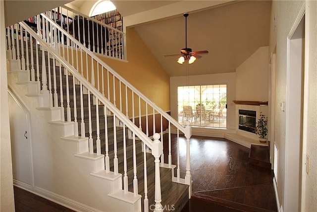 6102 Cabriolet Ct, Quartz Hill, CA 93536 - stairs featuring wood finished floors, ceiling fan, high vaulted ceiling, baseboards, and a tile fireplace