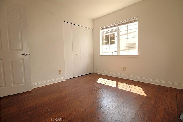 6102 Cabriolet Ct, Quartz Hill, CA 93536 - unfurnished bedroom with baseboards, wood finished floors, and a closet