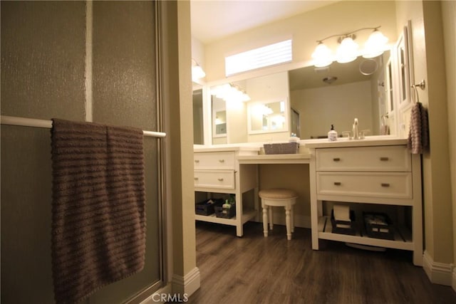 6102 Cabriolet Ct, Quartz Hill, CA 93536 - bathroom featuring wood finished floors and vanity