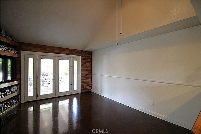 6102 Cabriolet Ct, Quartz Hill, CA 93536 - spare room with wooden walls, french doors, baseboards, healthy amount of natural light, and vaulted ceiling