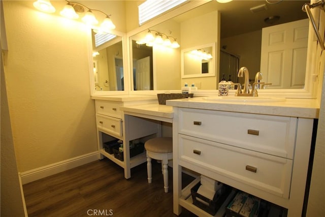 6102 Cabriolet Ct, Quartz Hill, CA 93536 - bathroom with wood finished floors, vanity, baseboards, and a shower