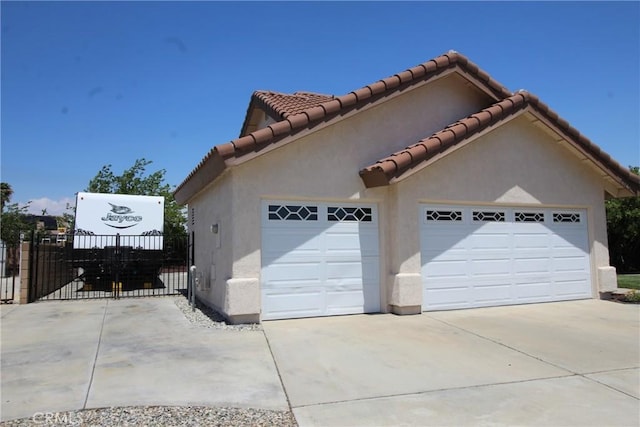 6102 Cabriolet Ct, Quartz Hill, CA 93536 - garage with concrete driveway, a gate, and fence