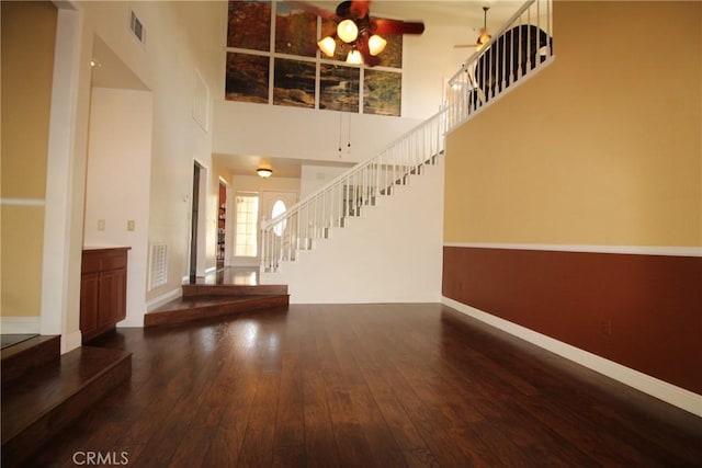 6102 Cabriolet Ct, Quartz Hill, CA 93536 - entrance foyer with stairway, a towering ceiling, a ceiling fan, hardwood / wood-style flooring, and baseboards