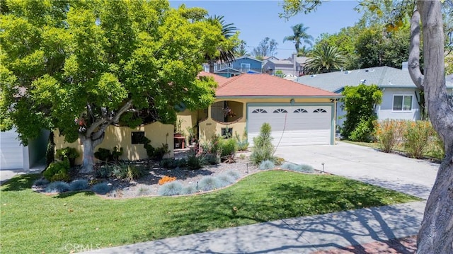 13611 Walnut St, Whittier, CA 90602 - view of front facade with stucco siding, concrete driveway, an attached garage, and a front lawn
