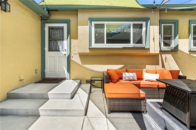 13611 Walnut St, Whittier, CA 90602 - entrance to property featuring stucco siding, outdoor lounge area, and a patio area
