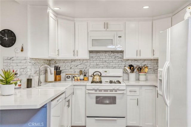 15155 Sherman Way Unit 14, Van Nuys, CA 91405 - kitchen with white appliances, white cabinetry, light countertops, backsplash, and recessed lighting
