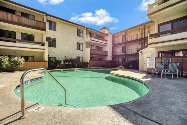 15155 Sherman Way Unit 14, Van Nuys, CA 91405 - community pool featuring a patio area