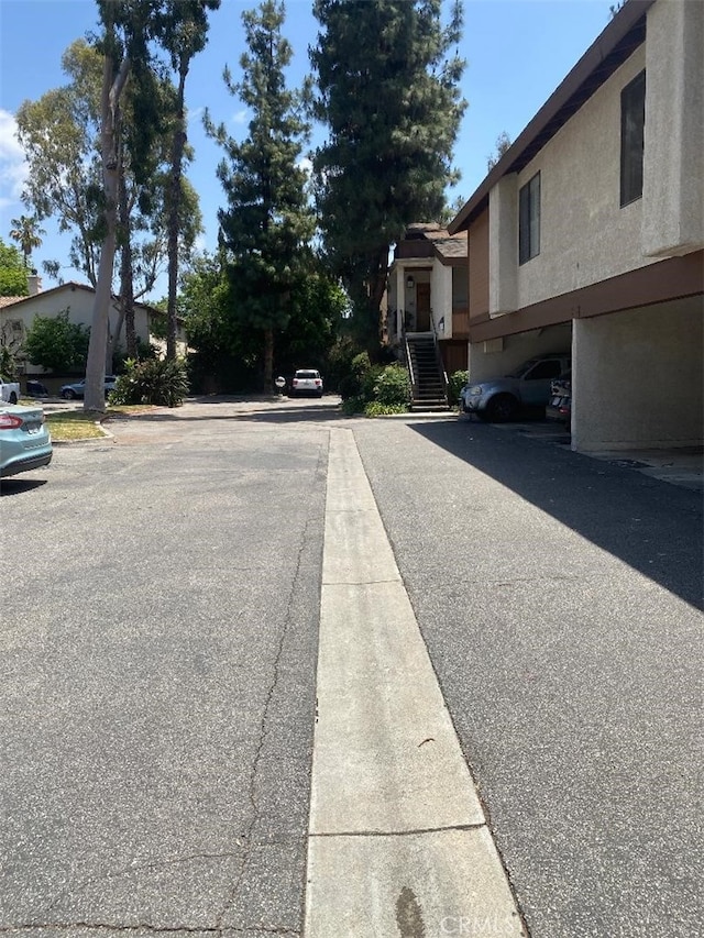 15155 Sherman Way Unit 14, Van Nuys, CA 91405 - view of asphalt road featuring stairway